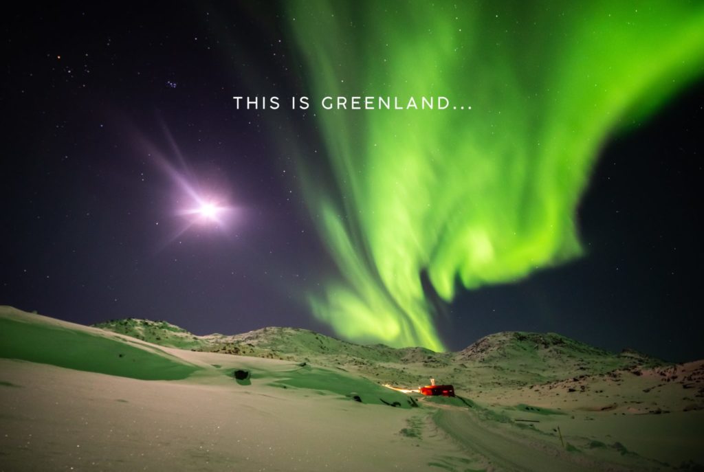 The northern lights with a text on top that reads "This is Greenland..."