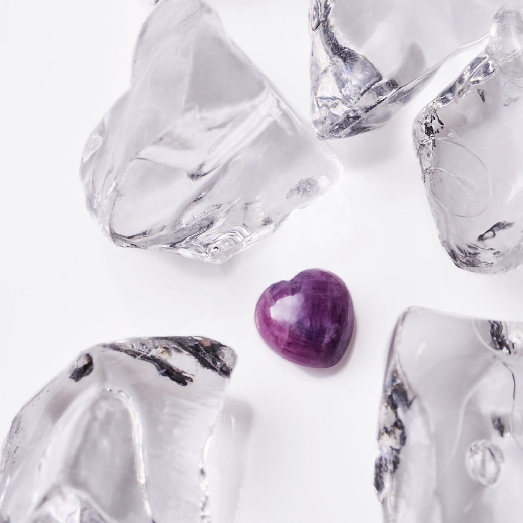 A heart-shaped ruby surrounded by ice 